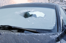 Image of ice partially scraped off a windshield