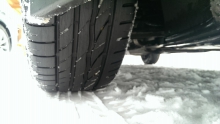 Image of tires moving through snow