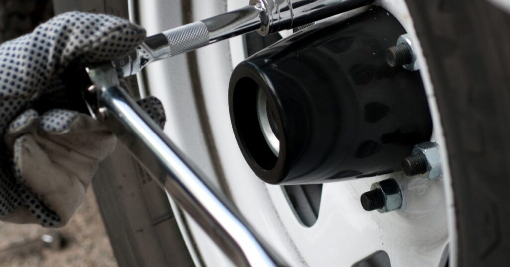 Image Of Tire Being Worked On With Tools