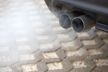 Image of exhaust pipes working on a car