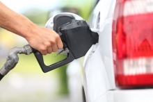Image of someone filling up a car with gas