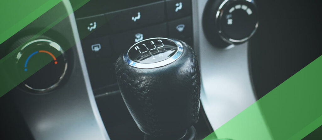 Zoomed in image of manual stick shifter with green edits
