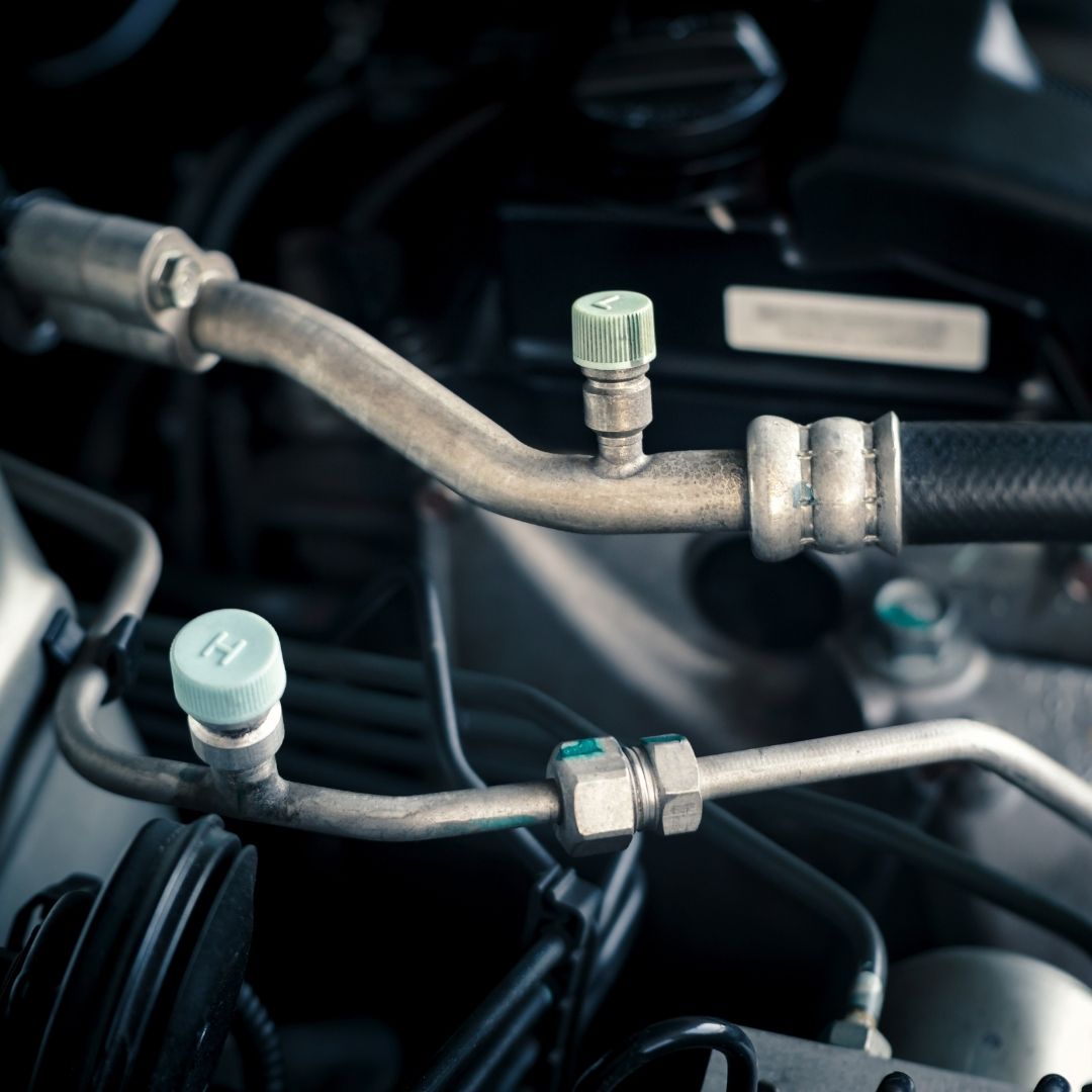 Hoses attached to car engine