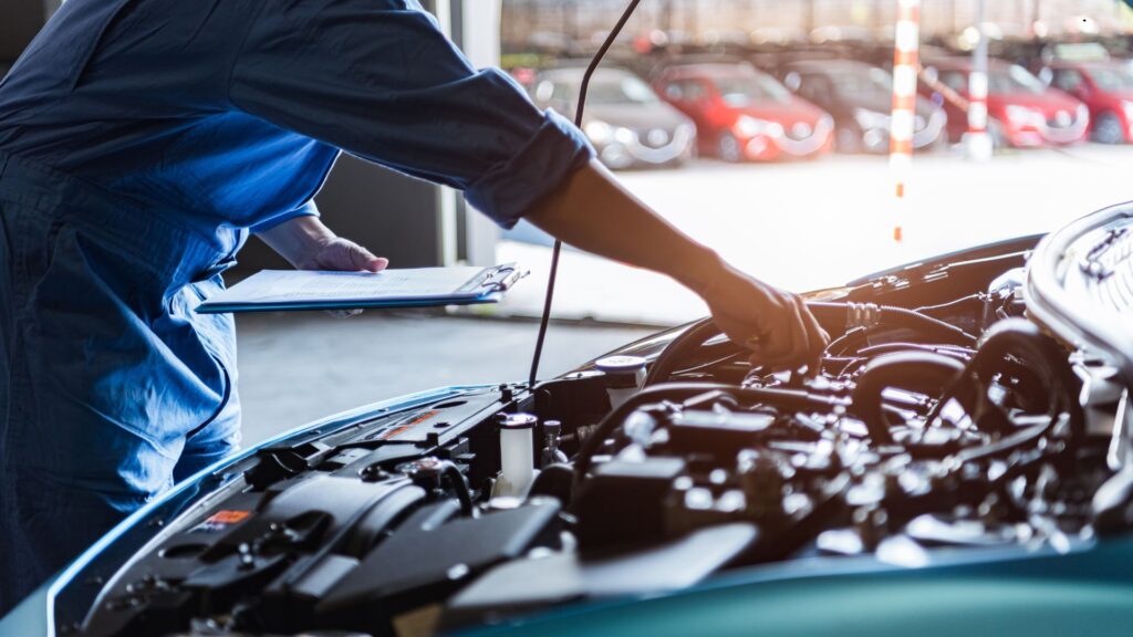 A mechanic working on an engine