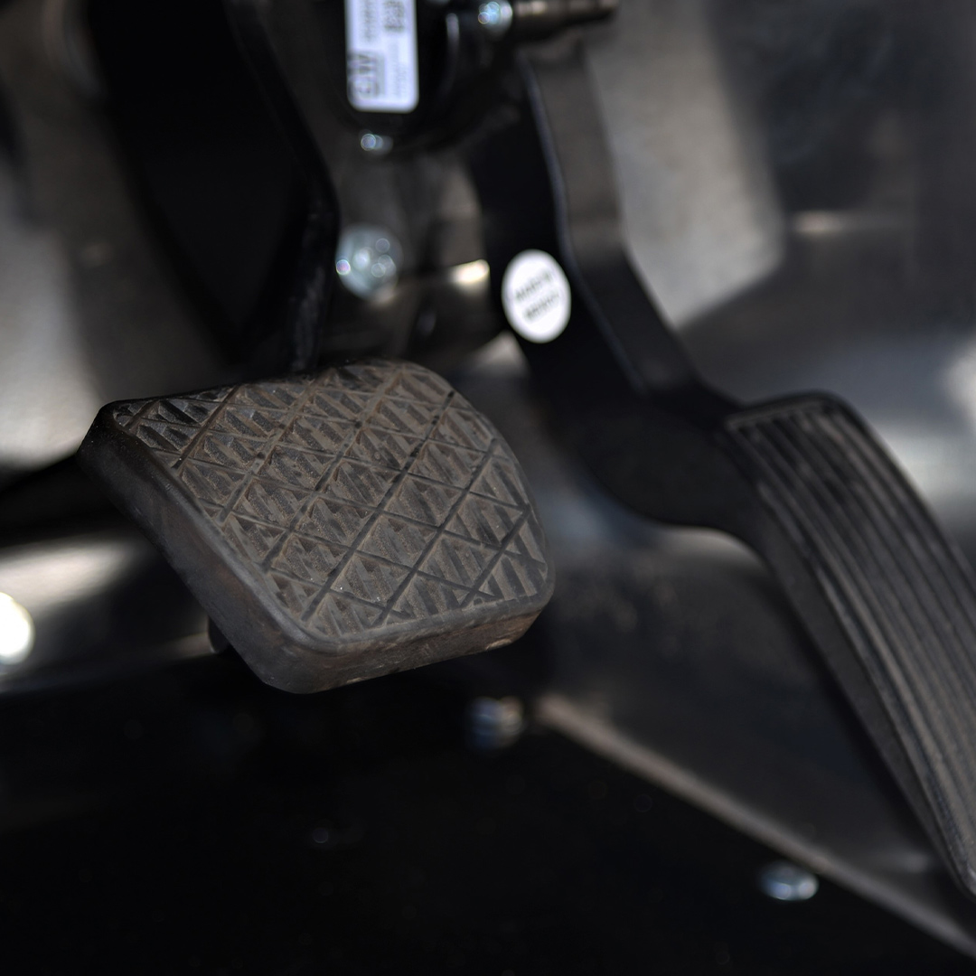a dirty brake pedal of a car